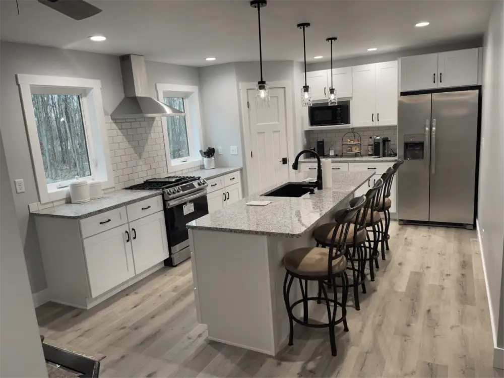Bright remodeled kitchen featuring wood cabinets and stainless appliances in Burt, MI